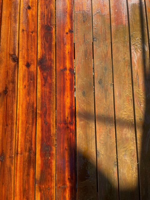 Close-up of a hydroxide stripper dissolving old film-forming stain on cedar boards
