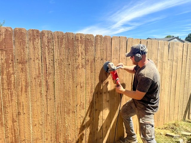 Buffing a stripped fence with an Osborn nylon cup brush