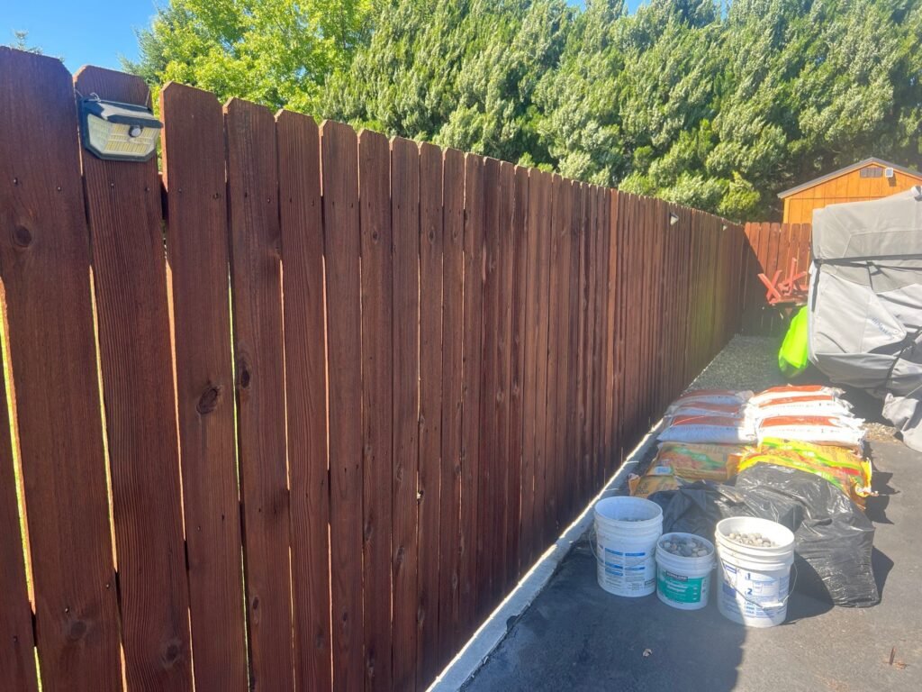 Same Pasco fence restored and stained in Chestnut